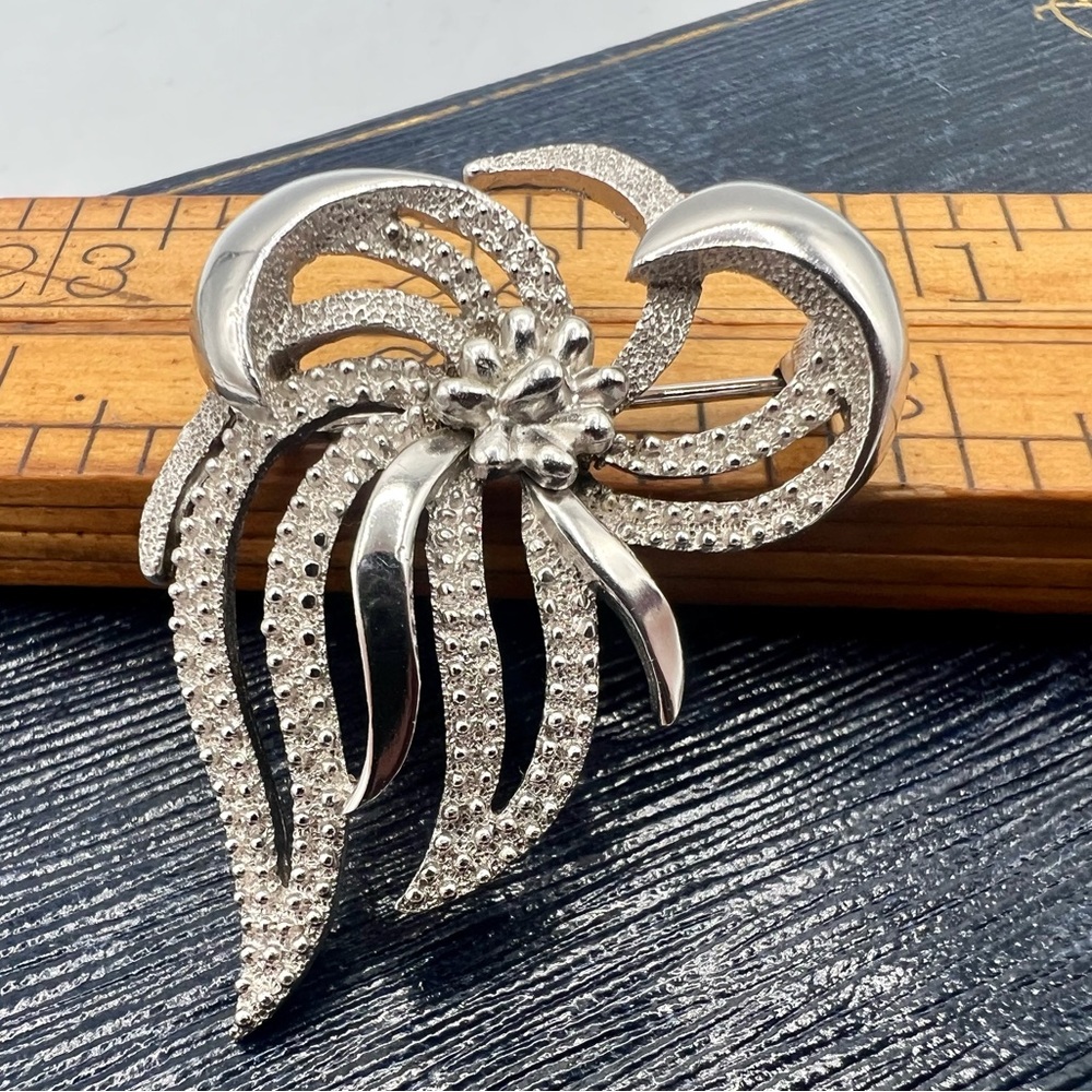 Vintage TRIFARI silver tone ribbon bow brooch